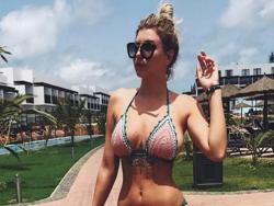 Olivia Buckland's boobs ooze from her bikini: When breasts have a life of their own